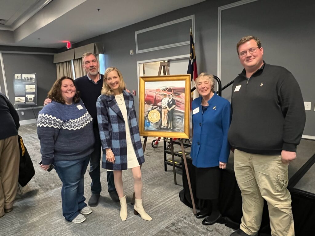 The Military Aviation Museum Honors “First Lady of Aviation,” Beechcraft Company Co-Founder, Olive Ann Beech 12 Beech Family and Museum Director: (From left to right): Carol Smith, Jeffrey Pitt (Grandson), Jennifer Pitt (Granddaughter), Mary Lynn Oliver (Daughter) and Museum Director, Keegan Chetwynd.