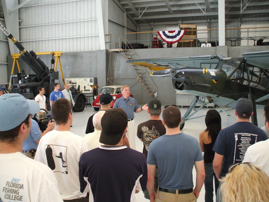 The Wings of Freedom Tour: A Legacy in Flight 12 Bob Collings giving a tour of the collection and history of WWII to a college group.