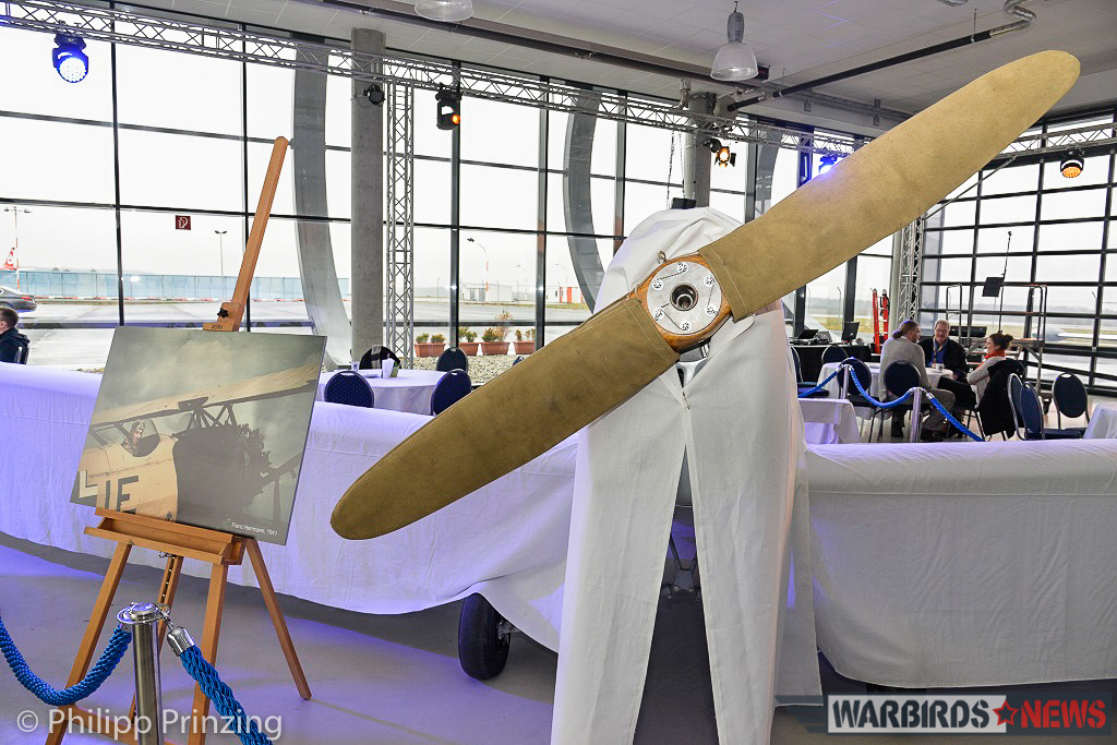 Freshly Restored Bücker Bü 180 Student Unveiled in Germany 12 The Bücker's nose, with a portrait of her previous, long-time owner, Franz Hermann to her left. (photo by Philipp Prinzing)