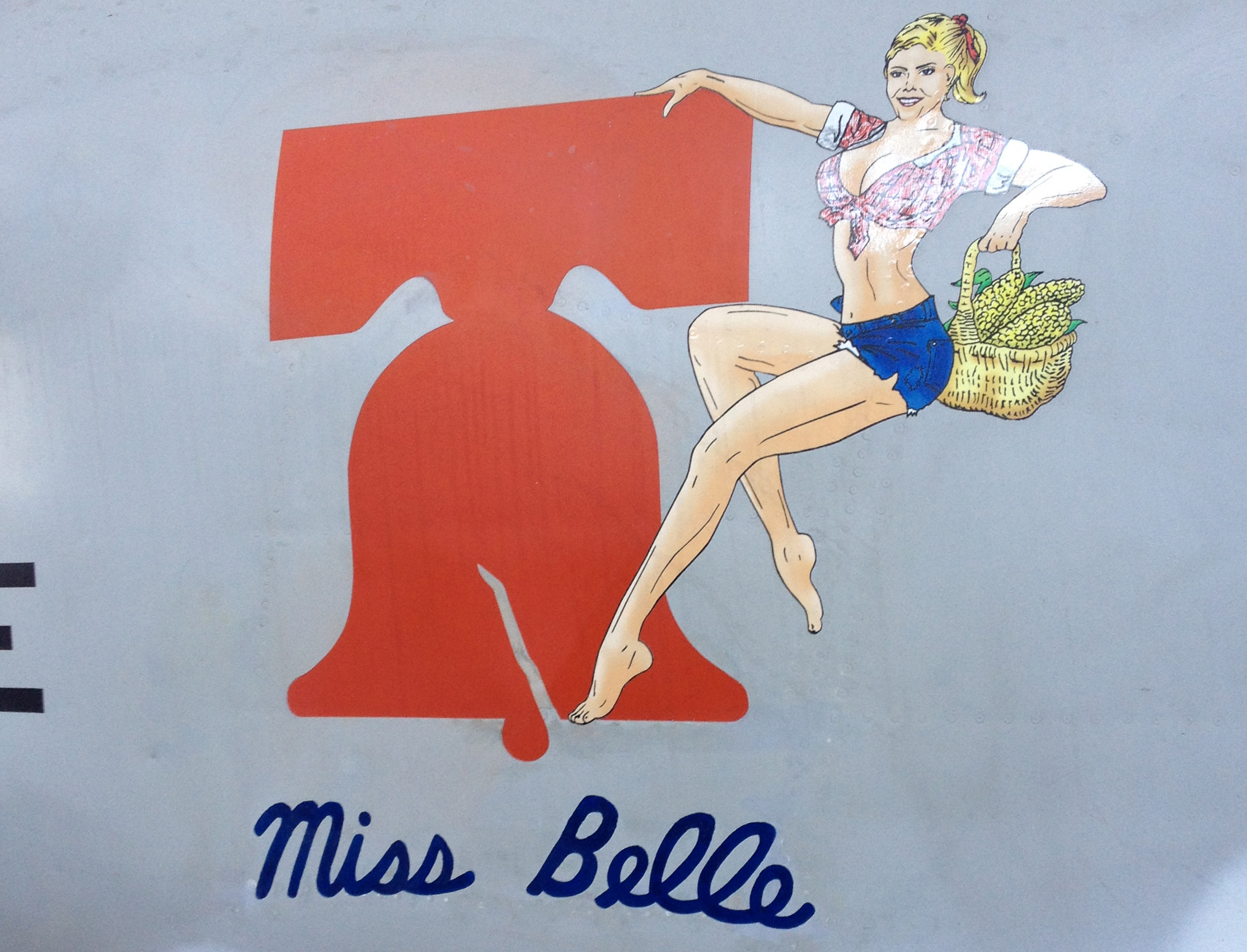 First Successful Season For C-1A Trader "Miss Belle" 13 A closeup of the nose art, or more correctly nacelle art, for 'Miss Belle'. The name is authentic, although the Daisy Duke element is a more recent addition. (photo via Doug Goss)