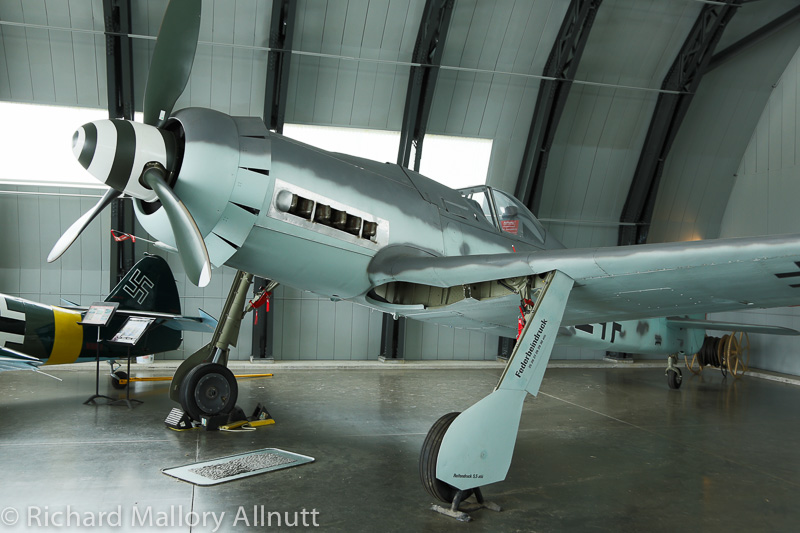 Warbirds Over the Beach - May 16th-18th, 2014 13 An airworthy Focke-Wulf 190D-9 replica in the original WWII Luftwaffe hangar once used at Cottbus in Germany. (photo by Richard Mallory Allnutt)