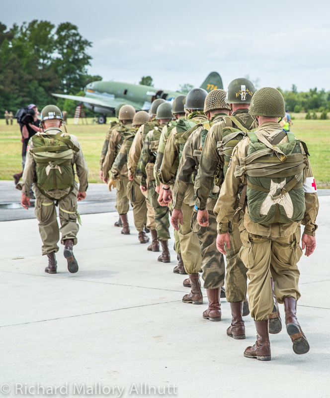 Warbirds Over the Beach - May 15th-17th, 2015 11 Members of the WWII Airborne Demonstration Team await boarding their Curtiss C-46F Commando troopship in Pungo, Virginia during the Warbirds Over the Beach Air Show in 2013. (photo by Richard Mallory Allnutt)