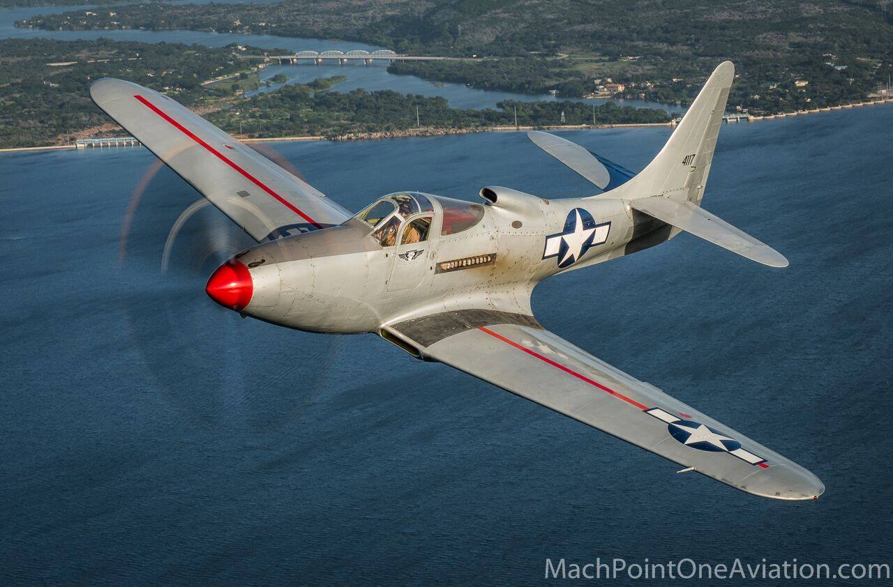 Oshkosh Cobra Flight - Four of Bell's Finest Fighters Together in the Air! 13 The CAF P-63F Sponsor Group over Houston. Photo by Glen Watson