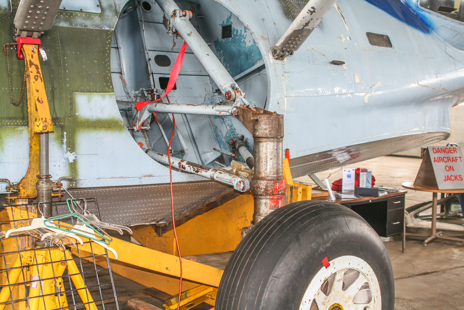 CAF PBY Catalina Restoration Update 26 The left side of the hull showing the main landing gear. Some work has been done here (checking the hydraulics, wheels and tires). The tires still need replacing.