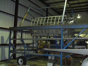 Lacey Lady Coming in From the Cold 10 "Lacey Lady's" forward fuselage, stripped and in a jig ready for rebuild at the B-17 Alliance Group's hangar in Aurora, Oregon