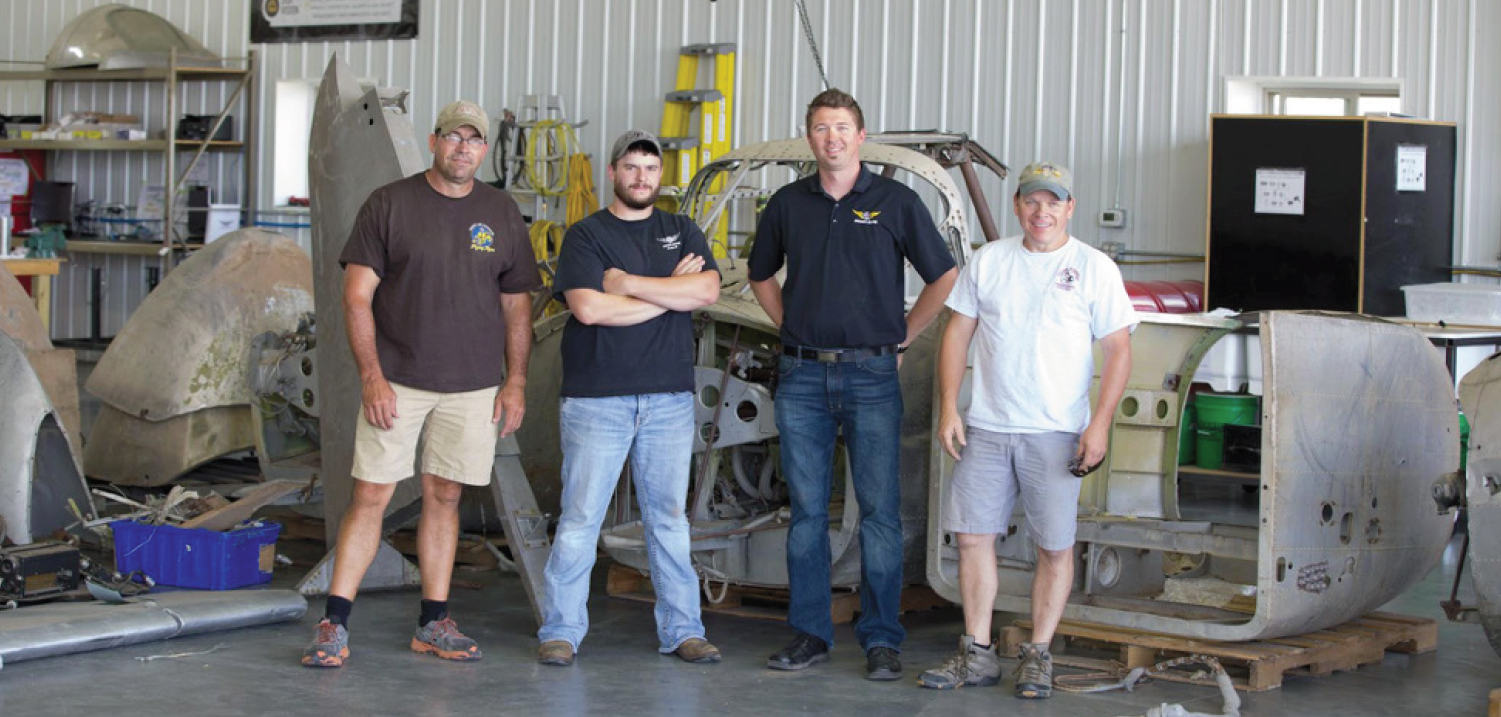 Cadet Air Corps Museum AT-10 Restoration Project 16 Left to right, Brooks Hurst, Tye Halvas (AirCorps Maintenance Manager), Erik Hokuf (AirCorps’ General Manager), and United States Congressional Representative Sam Graves of the Missouri Sixth District.