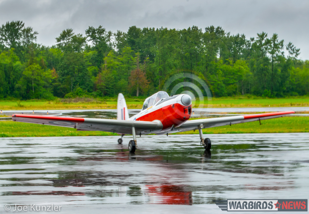 Heritage Flight Museum – June Fly Day Report 30 The chipmunk arriving in the rain. (photo by Joe Kunzler)