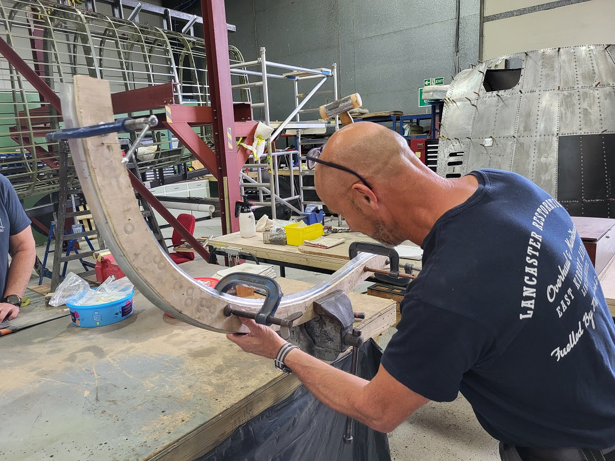 Lancaster NX611 ‘Just Jane’ – Restoration Update 226 21 Chris forming the new frame former for the nose of NX611