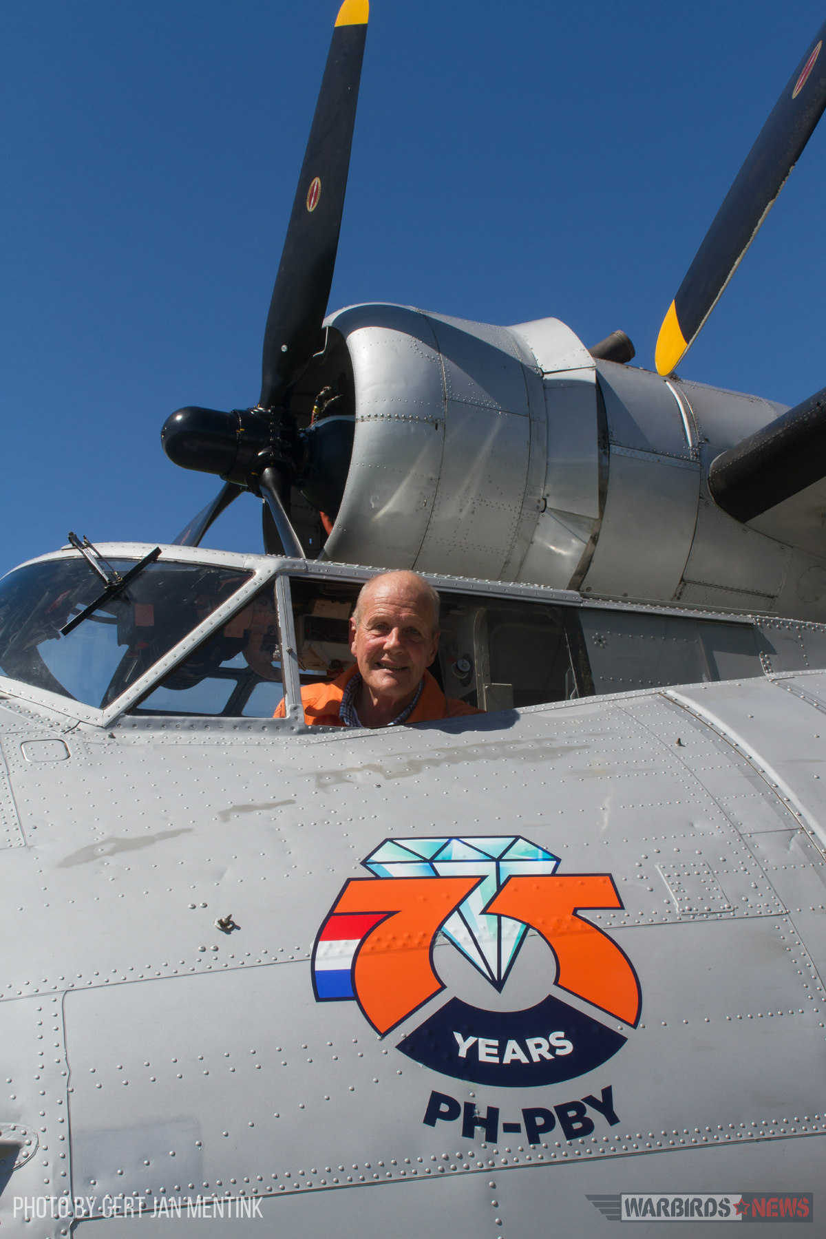 The World’s Oldest Flying PBY Catalina 14 Chief pilot Chris Goezinne in the cockpit of PH-PBY. In 2016, the Catalina Foundation celebrated the aircrafts 75th anniversary, as can be seen on this specially designed logo. It adorned PH-PBYs nose during the 2016 flying season. (photo Gert Jan Mentink)