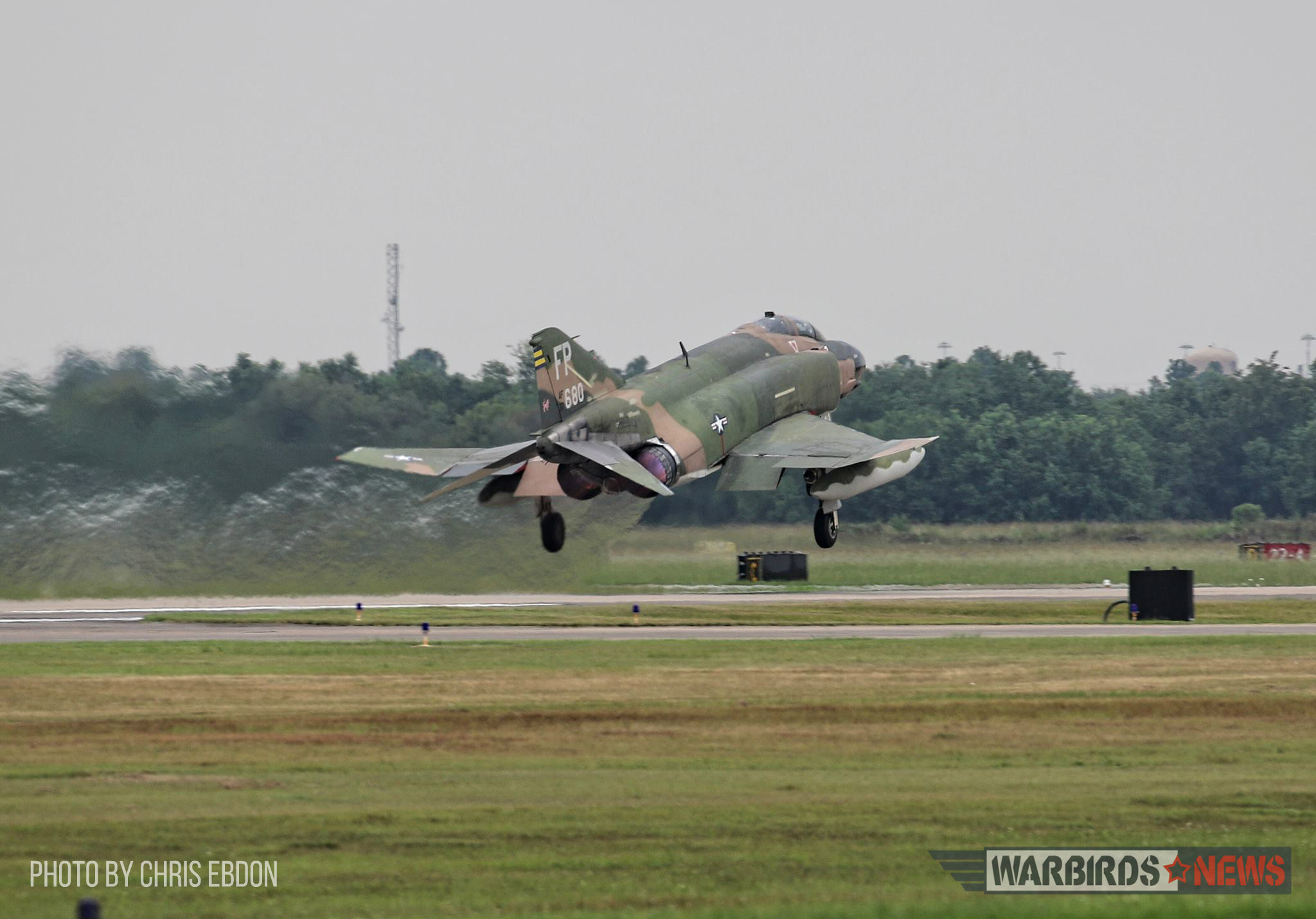 Collings Foundation's F-4 Phantom II Takes to the Skies Again! 12 D-Day getting water from young volunteer Katelyn Rose right after the successful flight. (Photo by Chris Ebdon)
