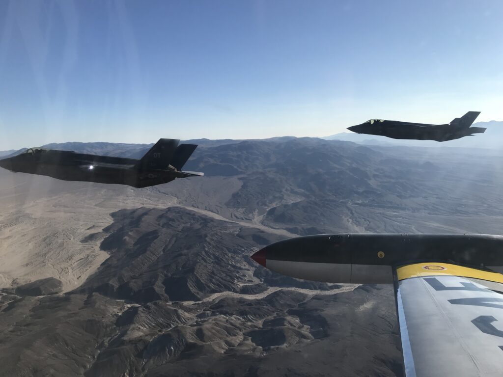 Gregory "WIRED" Colyer And His T-33 Ace Makers 18 Colyer in Ace Maker 1 returning to Edwards AFB with some F-35s after a training sortie (credit Greg Colyer)