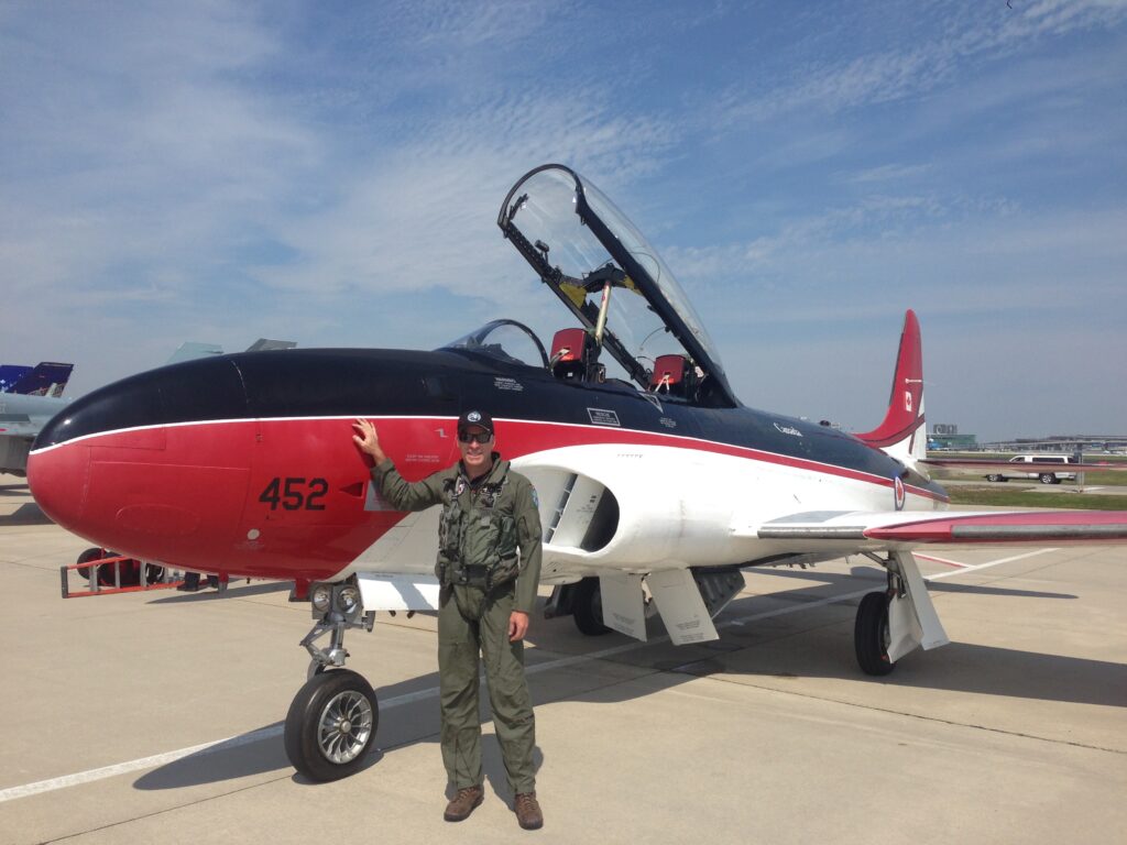 Gregory "WIRED" Colyer And His T-33 Ace Makers 26 Colyer with his Ace Maker 2 still in the RCAF colors from her service at Cold Lake (credit Greg Colyer)