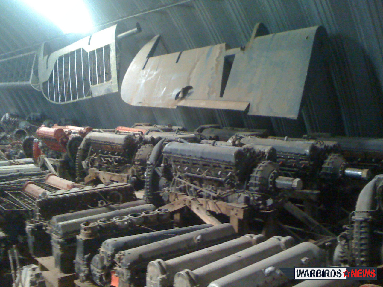 Messerschmitts Out of the Barn ... 12 Some of the many spare Merlin engines, and sundry parts for Buchons... you name it, in the hangars at Edwards' ranch. (photo via a friend of the Edwards family)