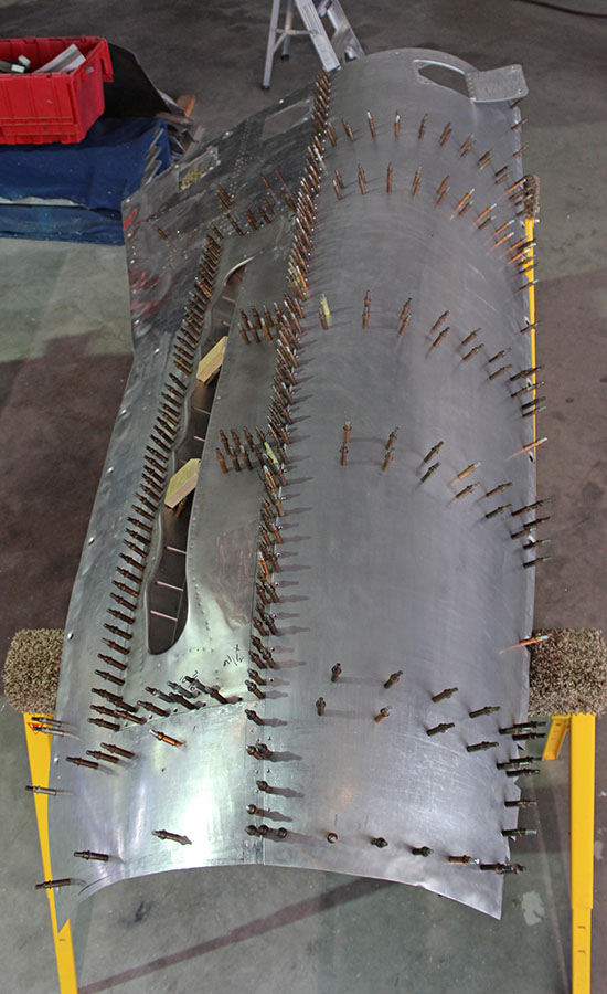 XP-82 Twin Mustang - May, 2017 - Restoration Update 19 An exterior view of the top right cowl for the right-hand engine during the tack-riveting process. Clecos are holding the ribs in place at this point. (photo via Tom Reilly)