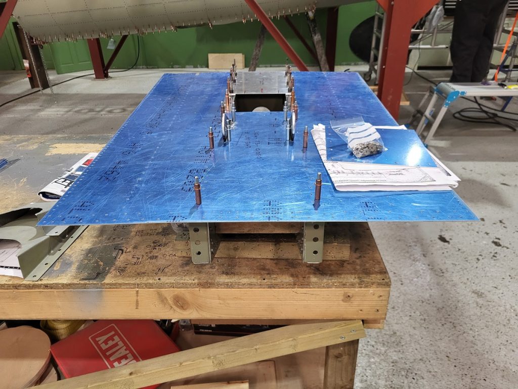 Avro Lancaster B.VII NX611 ‘Just Jane’ – Restoration Update 243 and 244 17 Cutting the glider tug bracket holes into the fuselage skin that fits below the tail oleo box.