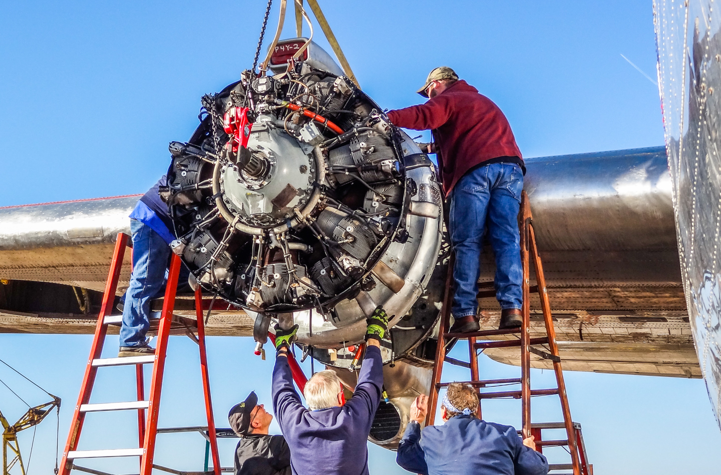 Privateer Airborne 36 Installing the #3 engine. (GossHawk Unlimited photo)