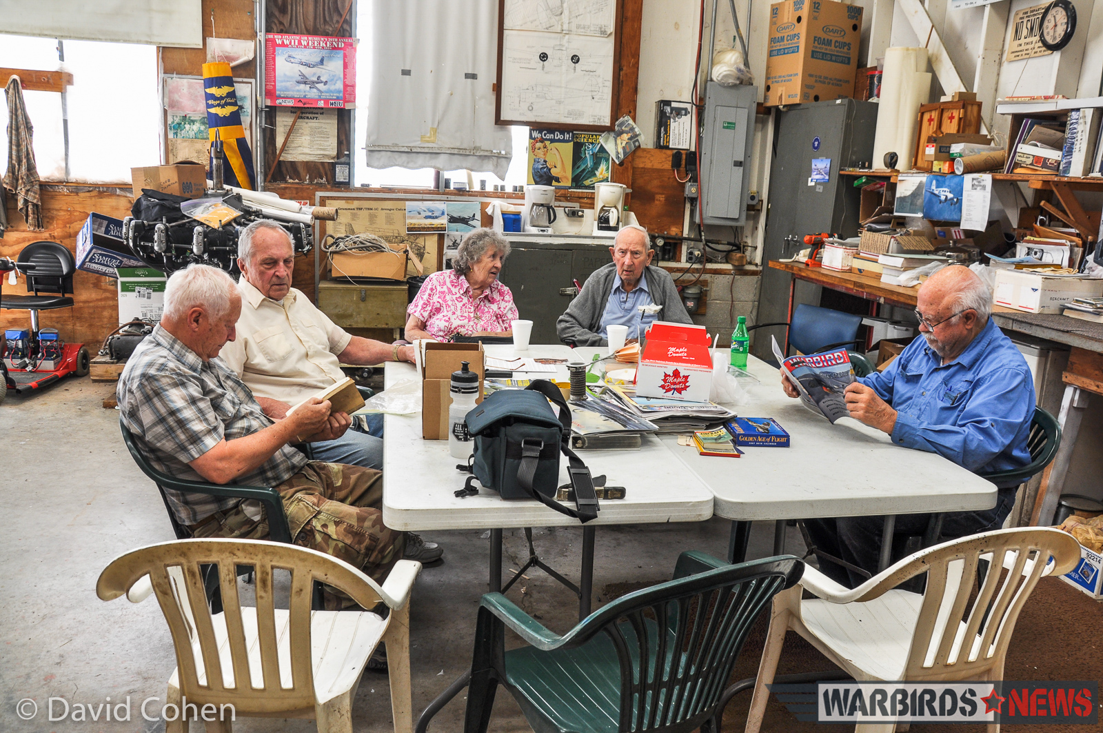 Jack Kosko's UC-78 Bobcat Restoration - July, 2016 Status Update 13 Some of the team at rest. At the table, left to right - Barry Stump, Dick Santora, Ruby Kosko, Jack Kosko and Gene Ambrose (notice Gene is reading Warbird Digest). (Photo by David Cohen)