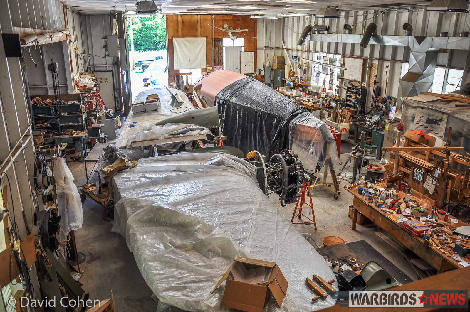 Jack Kosko's UC-78 Bobcat Restoration - July, 2016 Status Update 16 Partly covered in tarpaulins, the Bobcat awaits its journey north to Harland Avezzie's shop in Westfield, MA. (Photo by David Cohen)