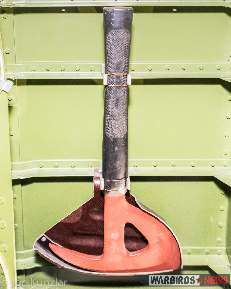 All-Access Tour of FHC's Superb North American B-25J Mitchell 14 The B-25's escape axe in its traditional holder on the fuselage wall. (photo by Joe Kunzlar)