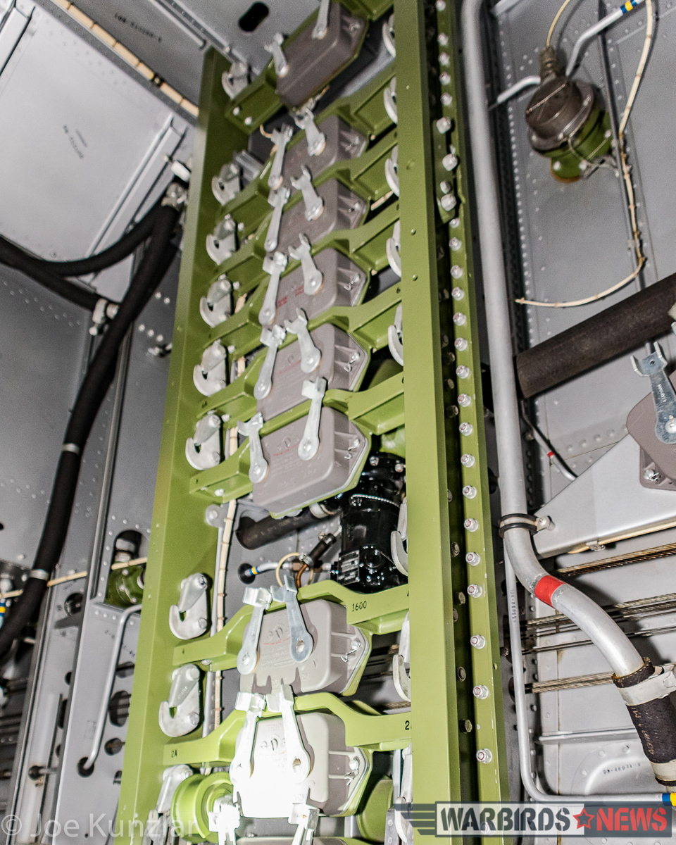 All-Access Tour of FHC's Superb North American B-25J Mitchell 19 A fascinating view of the Mitchell's bomb bay, showing the myriad solenoid-operated bomb shackles on the green rack. (photo by Joe Kunslar)