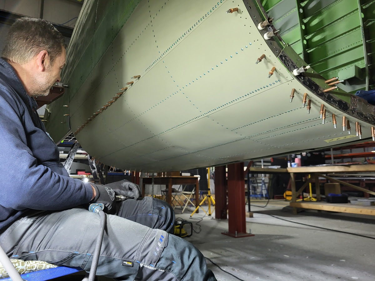 Avro Lancaster B.VII NX611 ‘Just Jane’ – Restoration Update 255,256 and 257 12 Dave preparing to complete a row of rivets on the rear mid fuselage of NX664