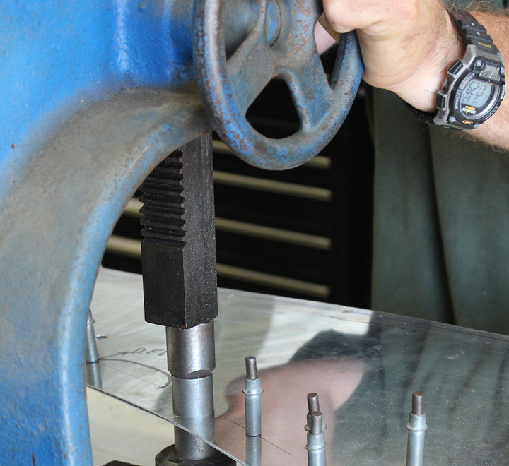 XP-82 Twin Mustang - June 2016 - Restoration Update 12 A close-up of the press-dimpling process for the Dzus fastener in the scowling side skins. (photo via Tom Reilly)