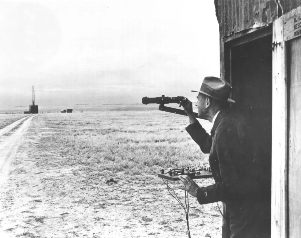 Today in Aviation History: First Gyroscopically-Stabilized Liquid-Fueled Rocket Launch 11 Dr. Robert H. Goddard observes the launch site from his launch control shack while standing by the firing control panel.