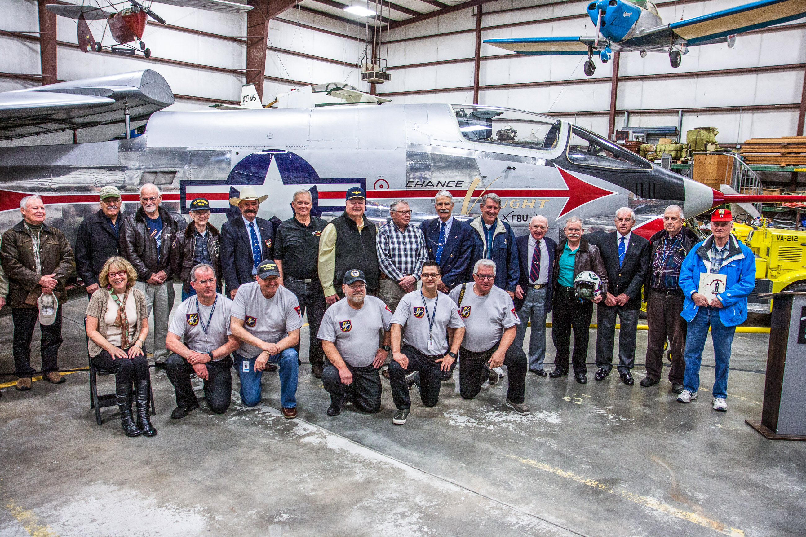 Museum of Flight Unveils XF8U-1 Crusader 18 The Museum of Flight's restoration team (kneeling in t-shirts) and the honored guests - the former Crusader pilots standing behind. (photo by Ted Huetter/Museum of Flight)