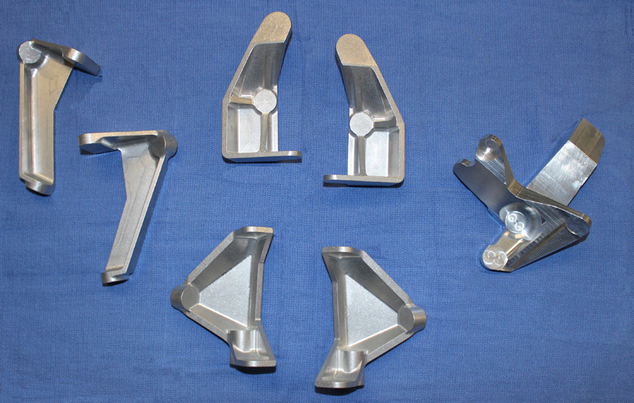 XP-82 Twin Mustang - September, 2014 Restoration Update 22 Freshly remanufactured forgings from Advanced Manufacturing Concepts for the main gear door opening/closing hook mechanisms. (photo via Tom Reilly)