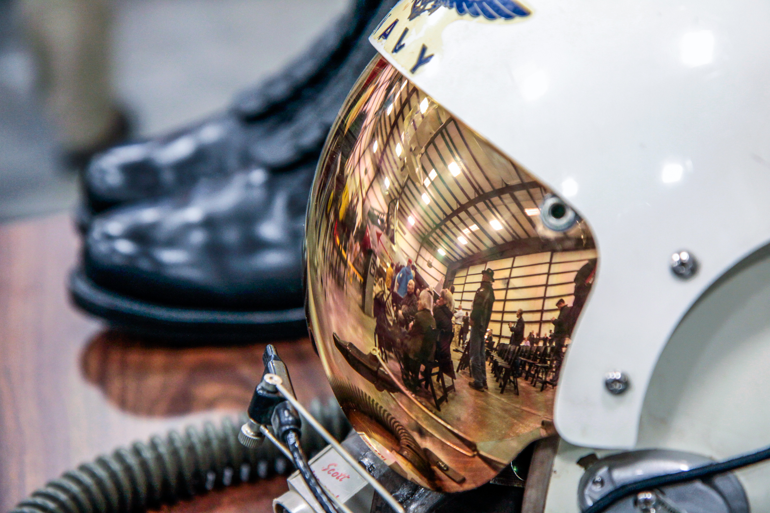Museum of Flight Unveils XF8U-1 Crusader 12 The XF8U-1 Crusader unveiling ceremony artistically caught in the visor reflection from a period US Navy flight helmet at the Museum of Flight's restoration hangar in Everett, Washington. (photo by Ted Huetter/Museum of Flight)