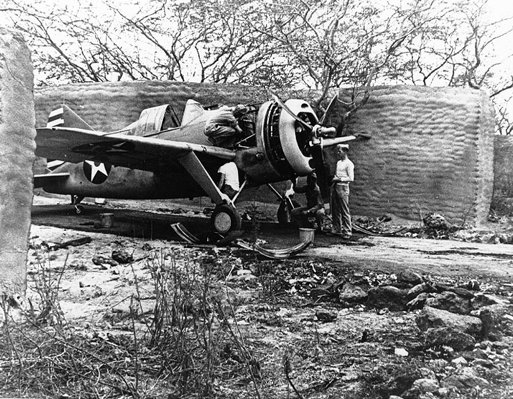 Ghosts of Pearl Harbor: Saving the Crossroads to Marine Aviation in the Pacific Theater 19 A Brewster F2A Buffalo (probably from Marine Corps Fighter Squadron VMF-221) undergoing maintenance in one of the early sandbag and stucco revetments at MCAS Ewa in April 1942.