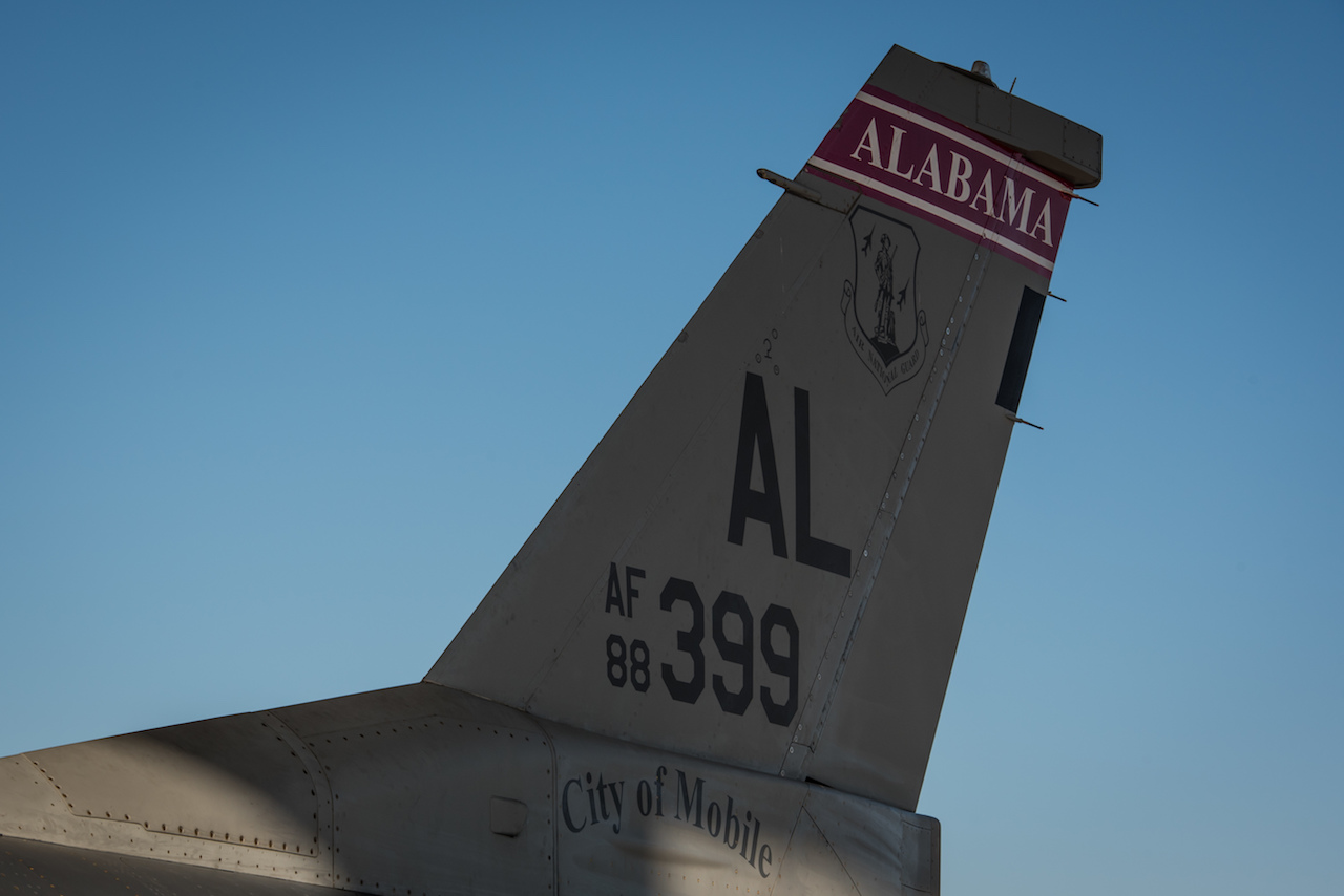 Red Tail Legacy Comes Full Circle 12 An F-16 from the Alabama Air National Guard arrives at the 407th Air Expeditionary Group where it is assigned to the 134th Expeditionary Fighter Squadron in support of Operation Inherent Resolve Dec. 10, 2016. The red tail flash of the jet brings the Tuskegee Airmen’s legacy back the 332nd Air Expeditionary Wing, to which the 134th EFS is currently assigned. (U.S. Air Force photo/Master Sgt. Benjamin Wilson)(Released)