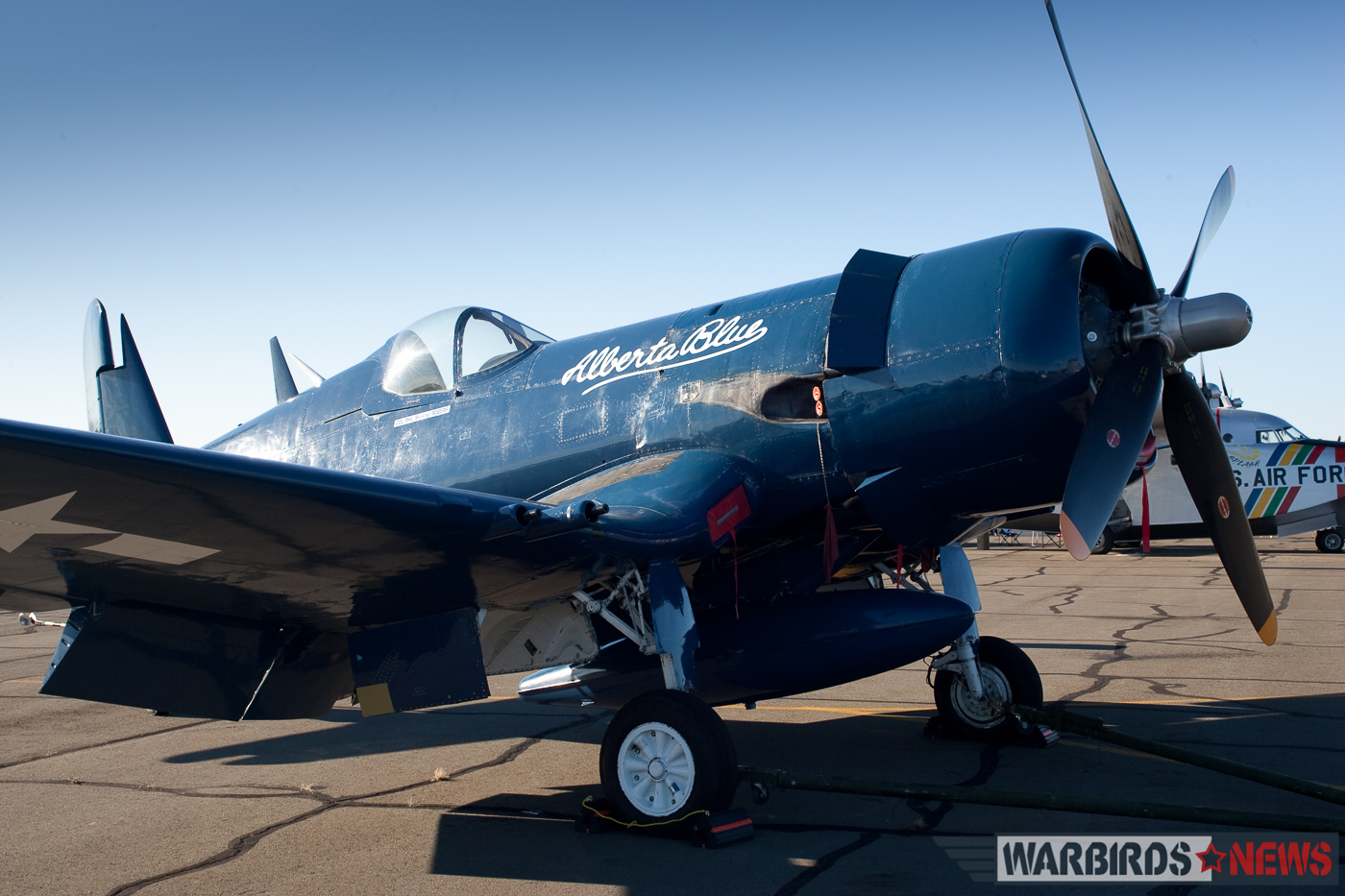 POOR LITTLE LAMBS - The Corsairs of Baa Baa Blacksheep 56 Bu.133710 shortly arriving in Manassas, Virginia under Philip Rogers ownership in October, 2004. She still wears the markings of her previous owner, Blain Fowler's Alberta Blue. (photo by Richard Mallory Allnutt)