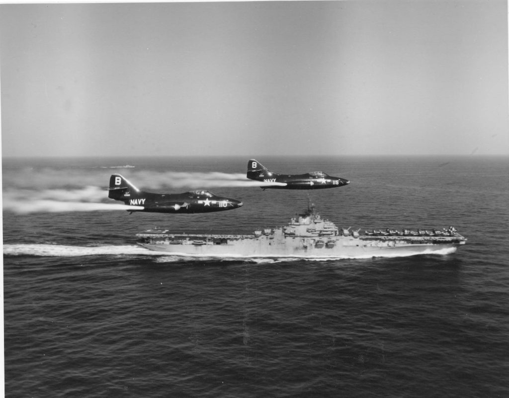 Today in Aviation History: Flying Blind 11 F9F Panthers of Fighter Squadron VF 191 fly over the aircraft carrier Princeton CV 37