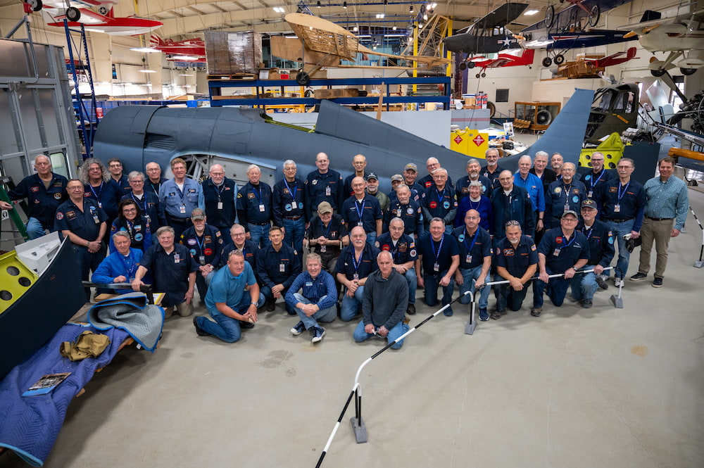 Celebrating The Completion of FM-2 Wildcat Recovered From Lake Michigan 17 FM 2 Wildcat 57039 Volunteers and Collilngs Visitors April 03 2023