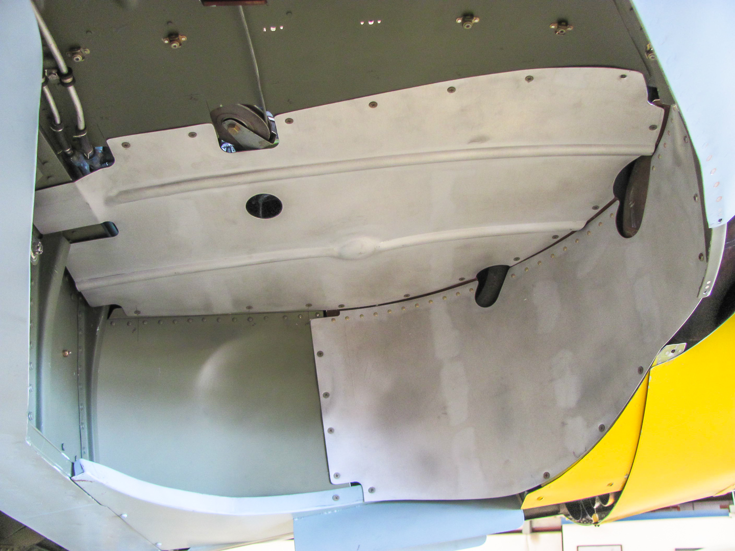 FW-190 First Flight At GossHawk Unlimited!!! 34 The bare metal pieces represent the newly manufactured/modified parts which were needed just so that the undercarriage would fit into the wheel wells properly. (photo via GossHawk Unlimited)