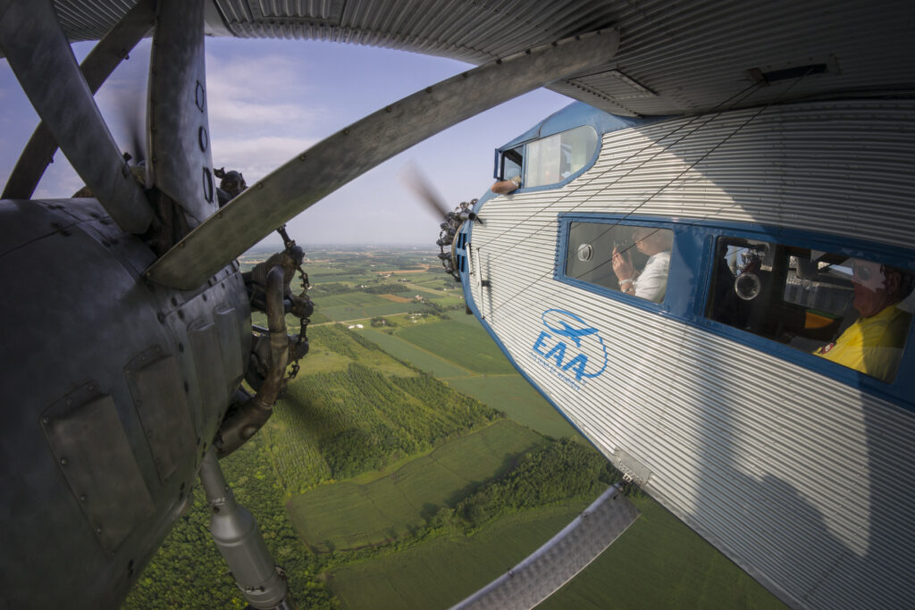 EAA Ford Tri-Motor Tour Brings Vintage Flight Experiences to Cities Across the U.S. in 2025 10 Ford Tri Motor wing mount view by Dennis Biela