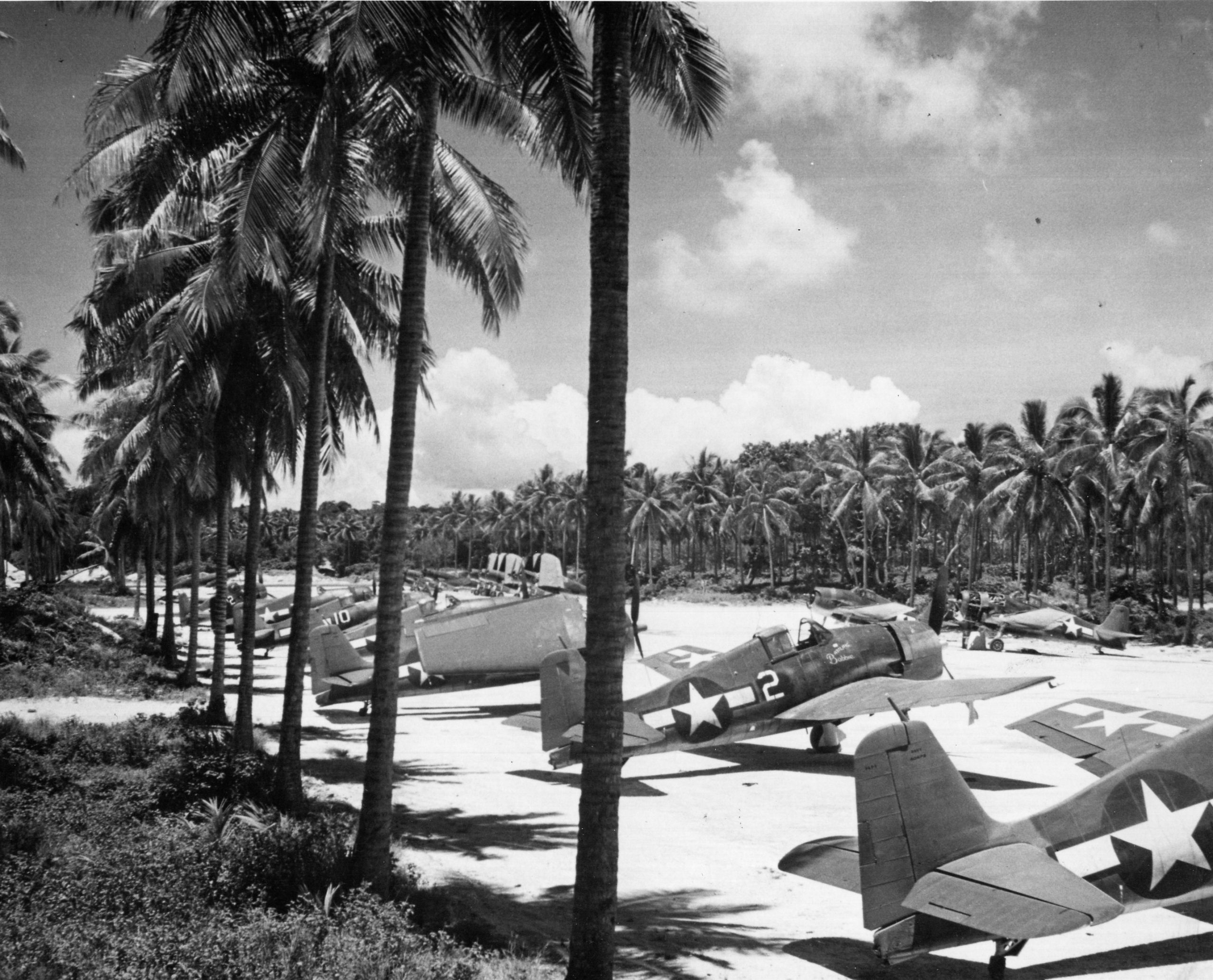 From the Bottom of the Sea to Wildwood: The Incredible Story of the F6F Hellcat at the NAS Wildwood Aviation Museum 26 Grumman F6F 3 Hellcat VF 40 White 2 at Munda airfield New Georgia Sep 1943 01 scaled