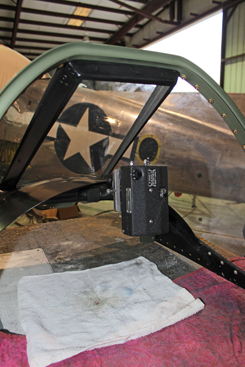 XP-82 Twin Mustang - December 2016 - Restoration Update 19 The gun strike camera being fitted on the right-hand glare shield. (photo via Tom Reilly)