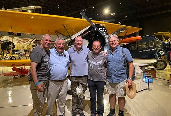 Udet's Curtiss Hawk II Reproduction Project 14 Hans Storck Rainer Berndt Fred Barber John Saunders and Matt Bauer in front of Ralph Rosaniks P 6E Hawk replica EAA