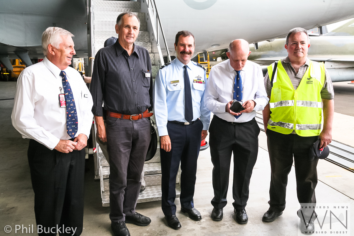 Former RAAF Lockheed Orion Officially Handed Over to HARS 31 Chief of Air Force Davies posing at the center, flanked by HARS members, including their president, Bob De La Hunty on the far left. (photo by Phil Buckley)