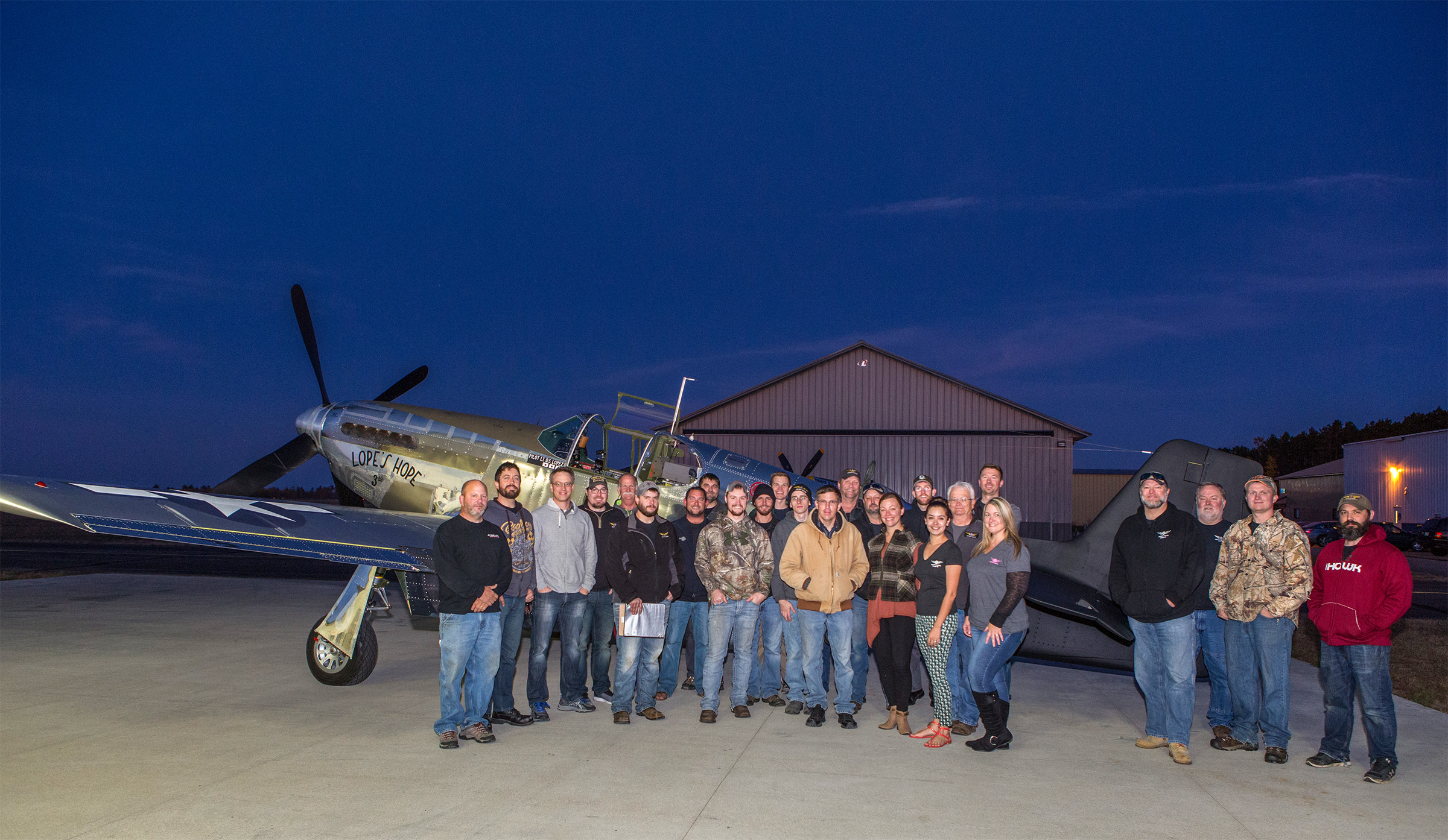Texas Flying Legends Museum’s P-51C Mustang 'Lopes Hope 3rd' Flies! 19 A very pleased AirCorps Aviation crew poses in front of Lope’s Hope 3rd after a squawk-free test flight. (photo by John LaTourelle via AirCorps Aviation)