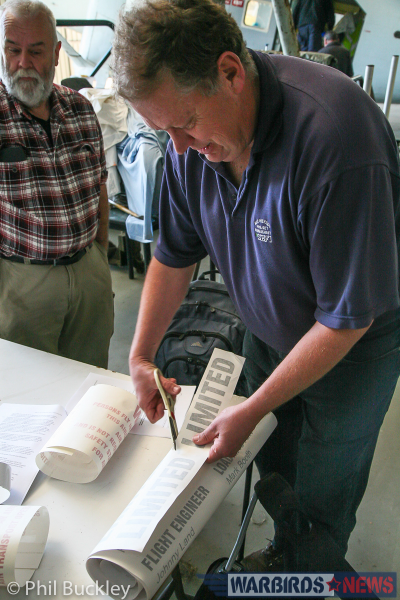 Twin Pioneer Restoration Update from Downunder 25 Richard Thompson cutting out the 'LIMITED' stencil prior to application. (photo by Phil Buckley)