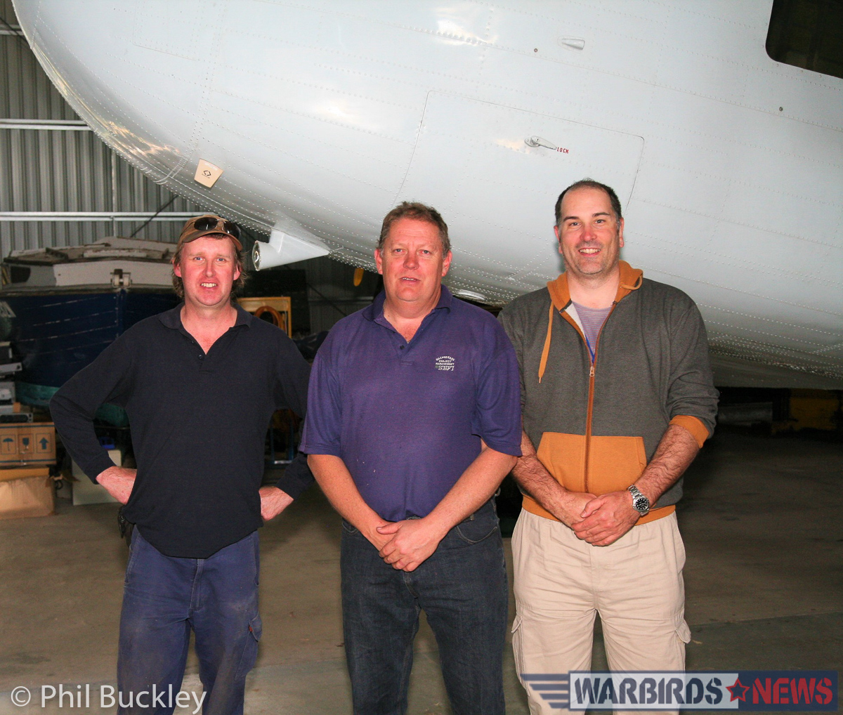Twin Pioneer Restoration Update from Downunder 38 (l-r) Mark Booth, Richard Thompson and Phil Buckley standing under the Twin Pin's nose. (Photo via Phil Buckley)