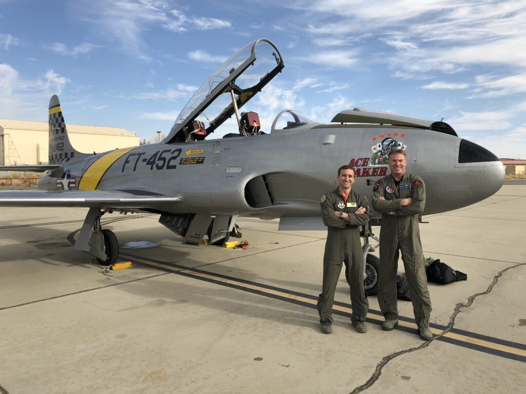 Gregory "WIRED" Colyer And His T-33 Ace Makers 19 Colyer and a happy test pilot student after a sortie at Edwards AFB (credit Greg Colyer)