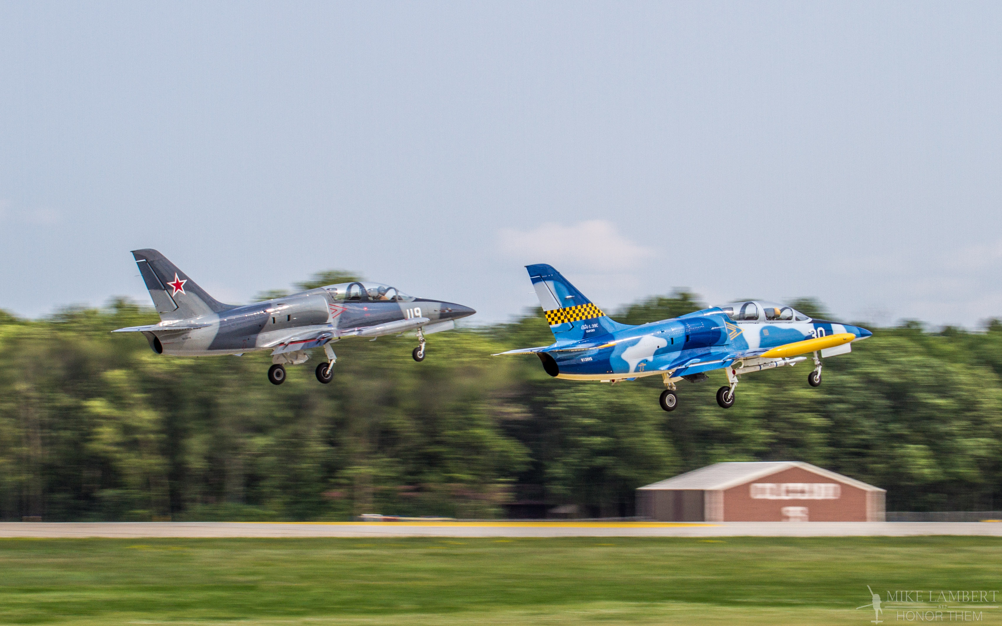 Livingston County Airshow 11 Ron Staley's L-39 (Blue/Yellow) is number taking off for a show at Oshkosh, WI.