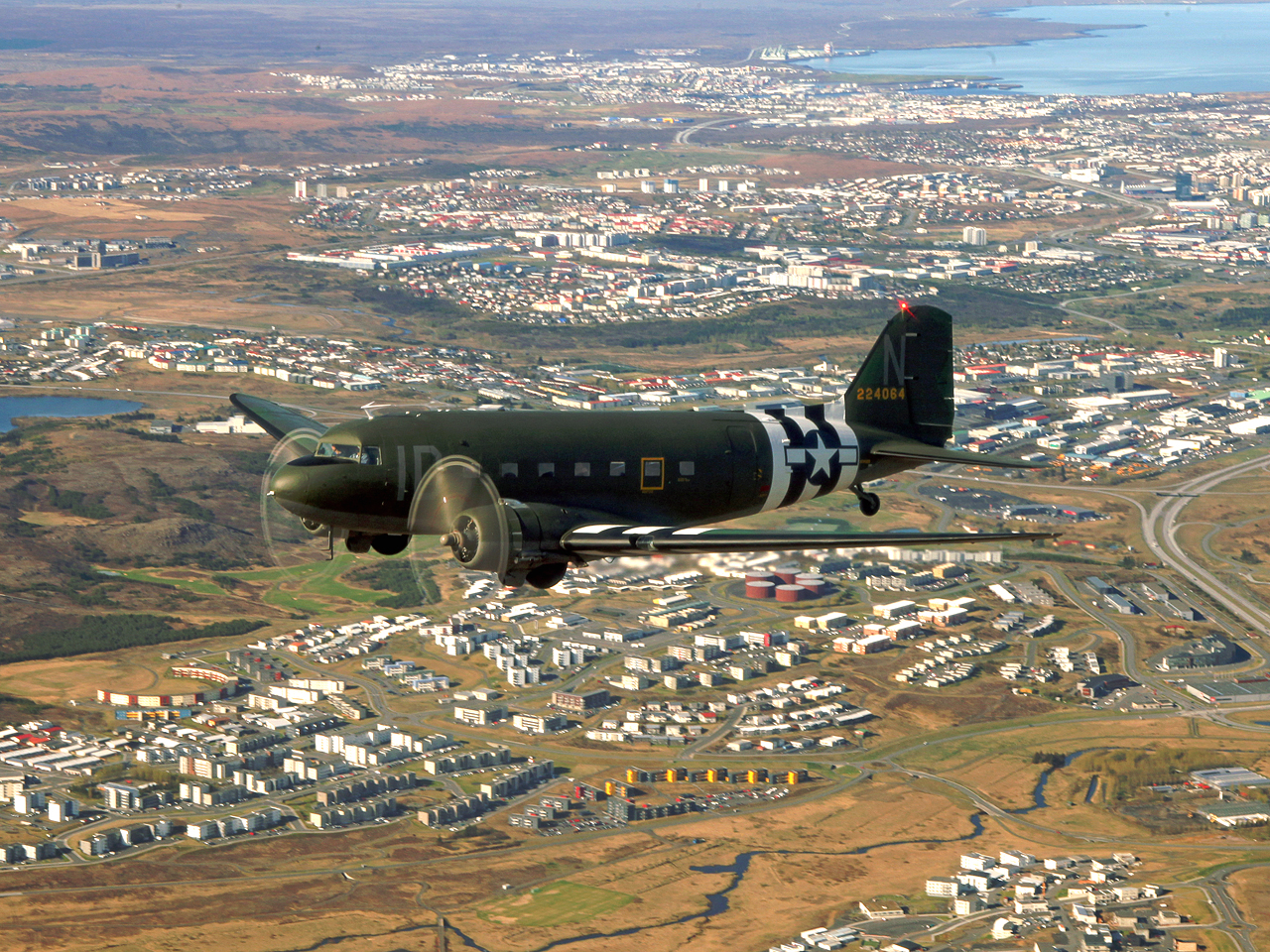 D-Day Daks Fly Over France for 70th Anniversary 13 "Union Jack Dak" over Reykjavik, Iceland during her journey out to France. (photo by Baldur Sveinsson)