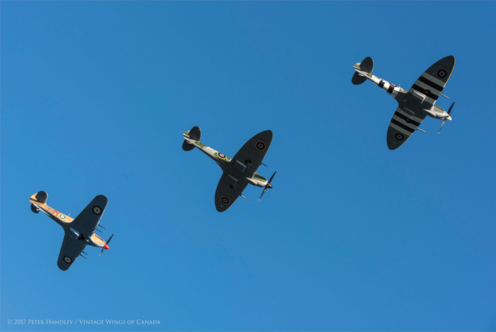 A sunset Mission to Honor the Canadians in The Battle of Britain 12 In the lead is Mike Potter in the Spitfire Mk IX, followed by Aitken in the Spitfire Mk XVI and Erdos in the Hurricane IV. Photo- Peter Handley, Vintage Wings of Canada
