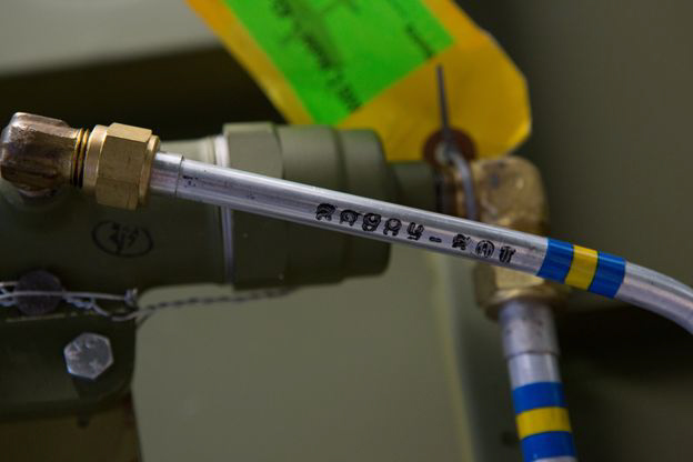 Texas Flying Legends P-51C Restoration Report 27 The hydraulic line that leads from the manual emergency hydraulic pump. Note the perfectly replicated color coding and part number on the tubing. (photo via AirCorps Aviation)