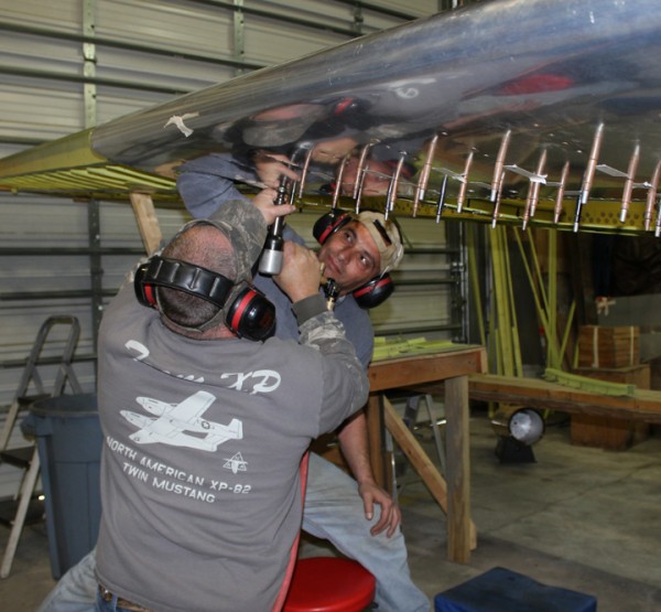 XP-82 Twin Mustang Restoration - March 2014 Update 12 Riveting the right-hand wing leading edge skins. (photo via Tom Reilly)